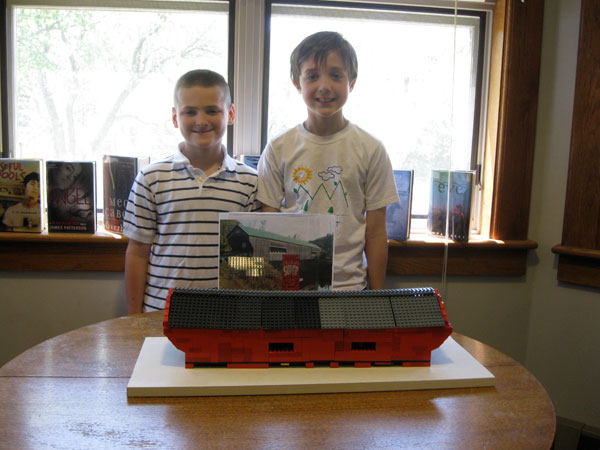 Jack Dunn, age 10 at left, and Sawyer Pippin, age 9  both of Chester  stand beside the model of the wooden covered bridge on Lower Bartonsville Road in Rockingham that they built for the 2012 LEGO contest run by St. Luke's in Chester.