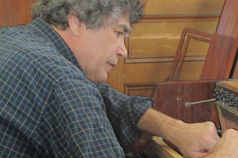 Don Dalton of Smokeshire Piano Service Repairs Whiting Library's Piano
